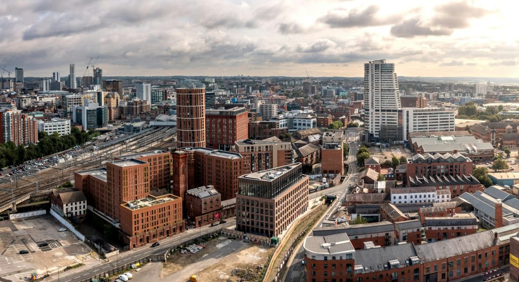 Aerial panorama of Leeds cityscape skyline at sunrise